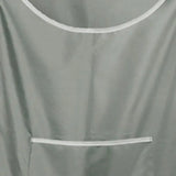 a grey shirt hanging on a wall