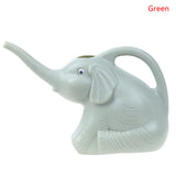 a small elephant shaped planter with a white background