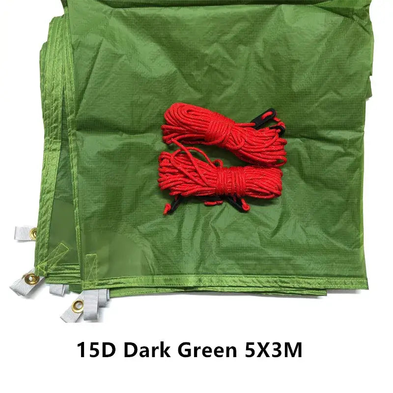 a green bag with red cords and a white tag