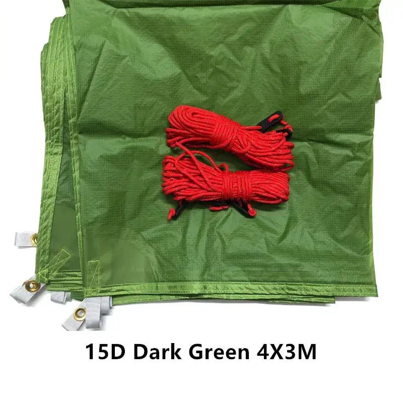 a green bag with red cords and a white tag