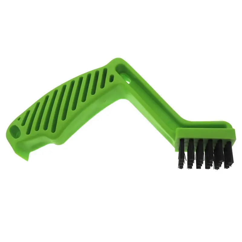 a green plastic brush with black bristles