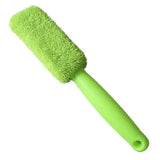 a green brush with a white background