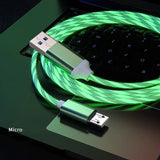 a green usb cable connected to a laptop