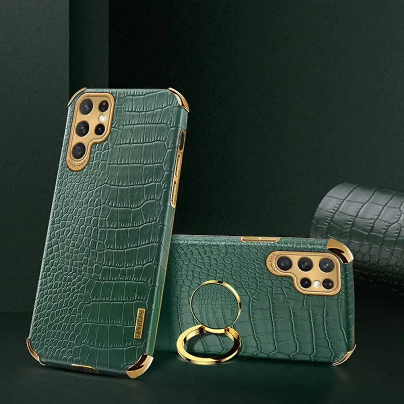 a green case with a ring and a phone case
