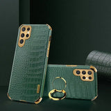 A green case with a ring and a phone case