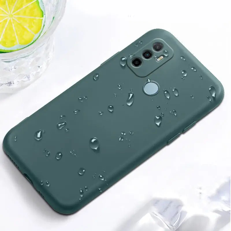 the back of a green case with water droplets on it