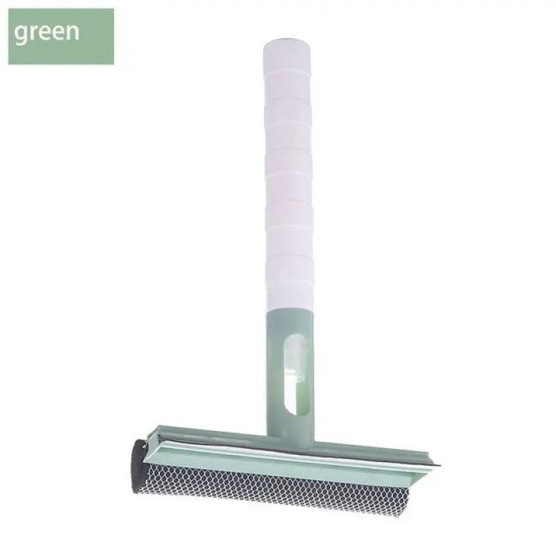 a green brush with a handle