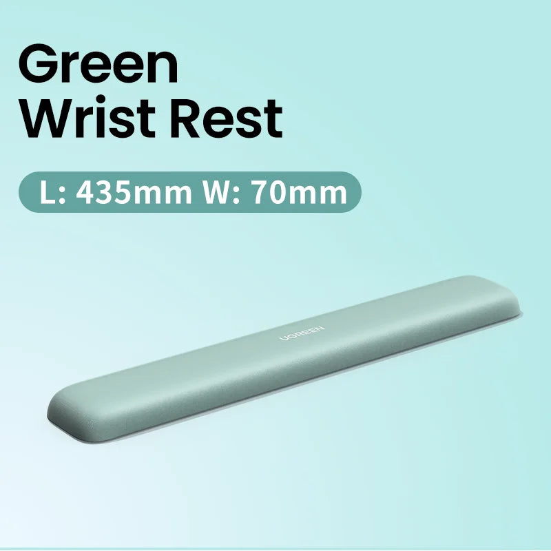 Green elongated ergonomic wrist rest for keyboard use.