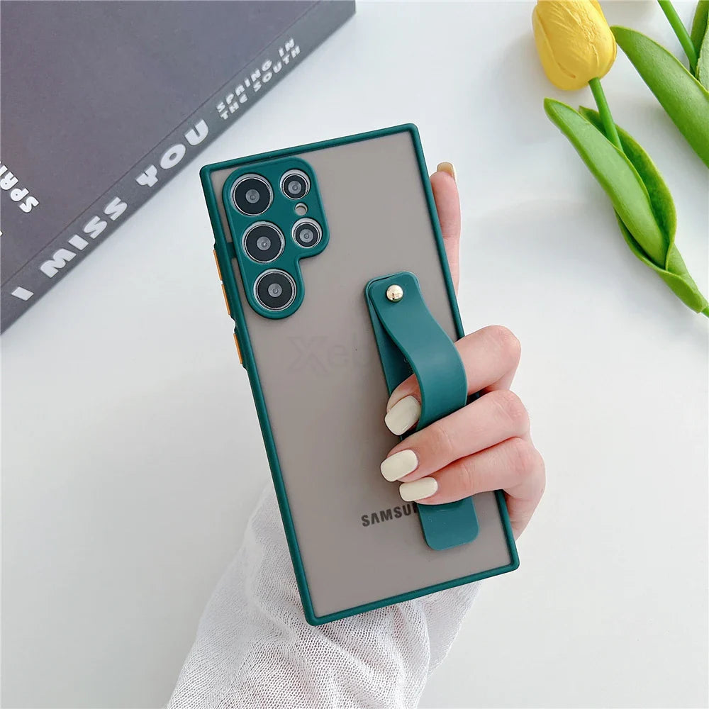 Green-framed translucent phone case with an integrated teal strap.