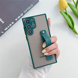 Green-framed translucent phone case with an integrated teal strap.
