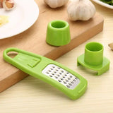 there is a green grater and a cup on a cutting board