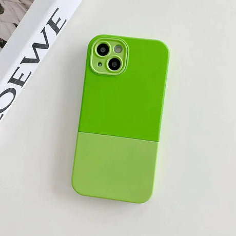 The green iphone case is next to a magazine