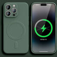 Green iPhone with MagSafe charging case displaying battery charging status on screen.