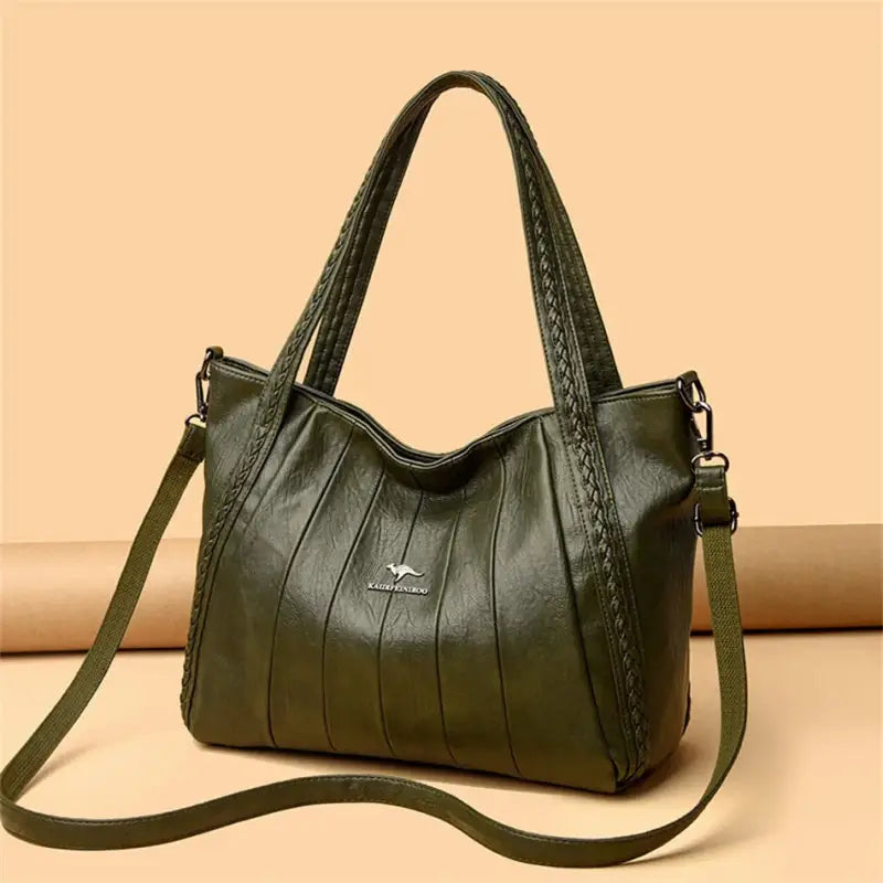 a green leather handbag with braid detailing