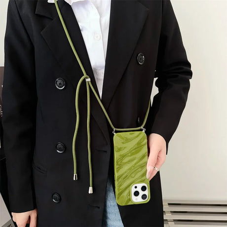 Green marble-patterned phone case with a matching crossbody strap.