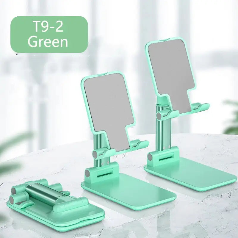 a pair of green makeup mirrors on a table
