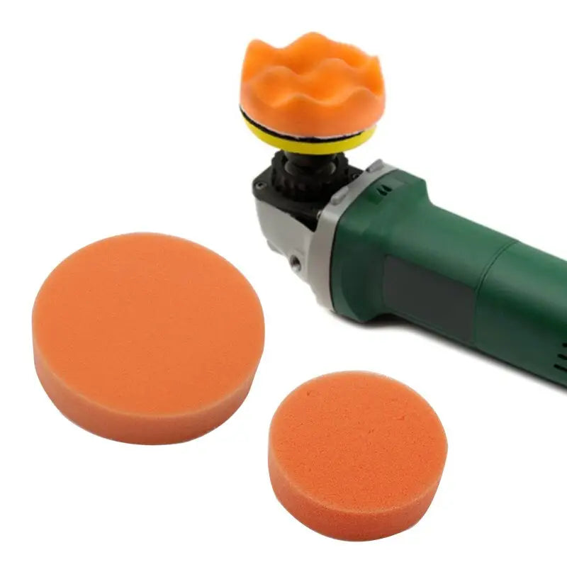 a green and orange polisher and a sponge