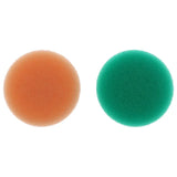two different colored sponges on a white background