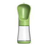 a green pepper grinder with a plastic handle