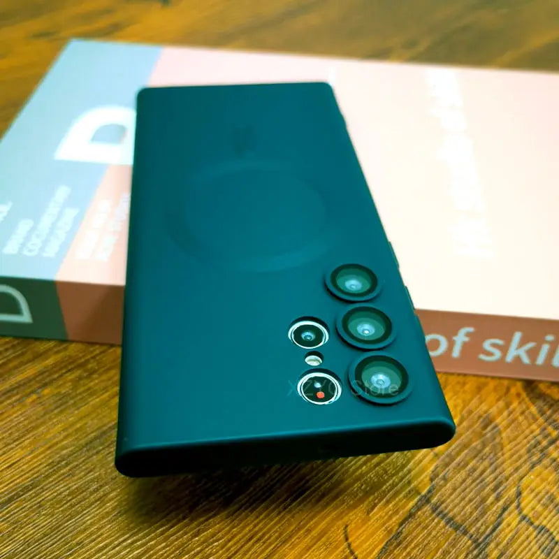 the back of a green phone with a box on it