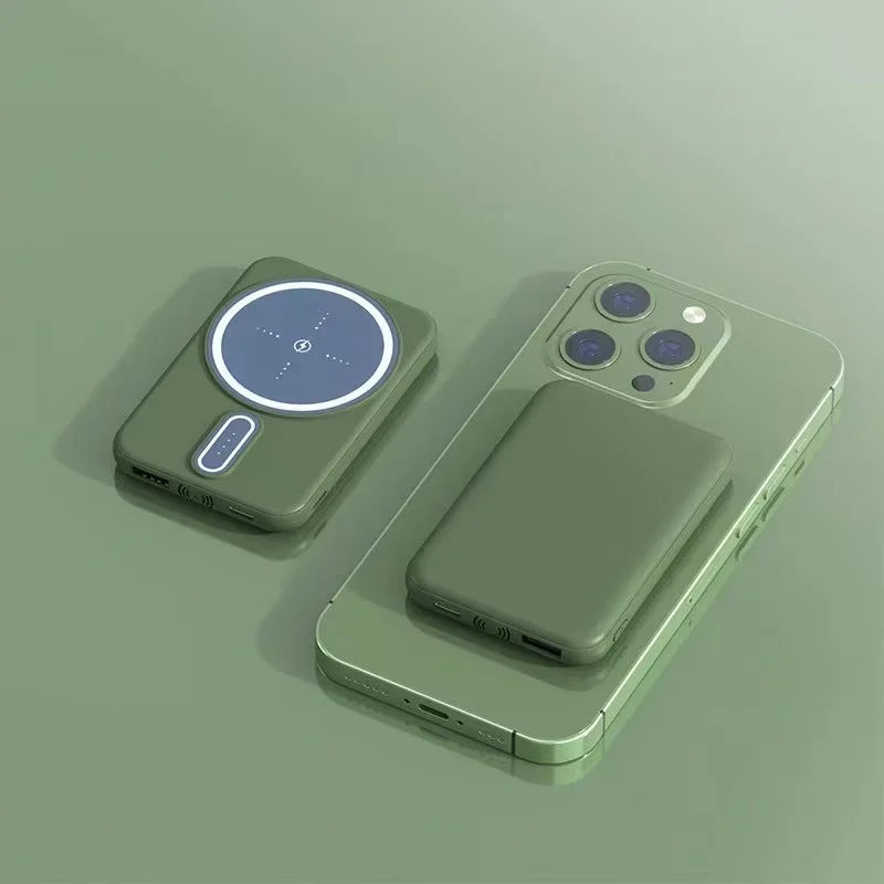 a green phone with a button on the back