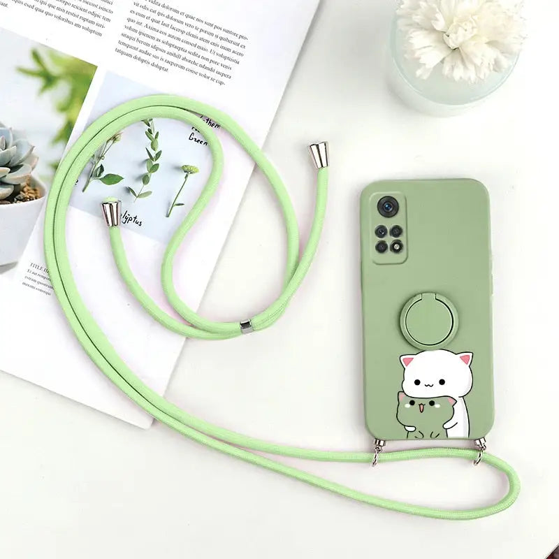a green phone case with a cat on it