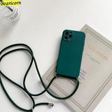 a green phone case sitting on top of a book