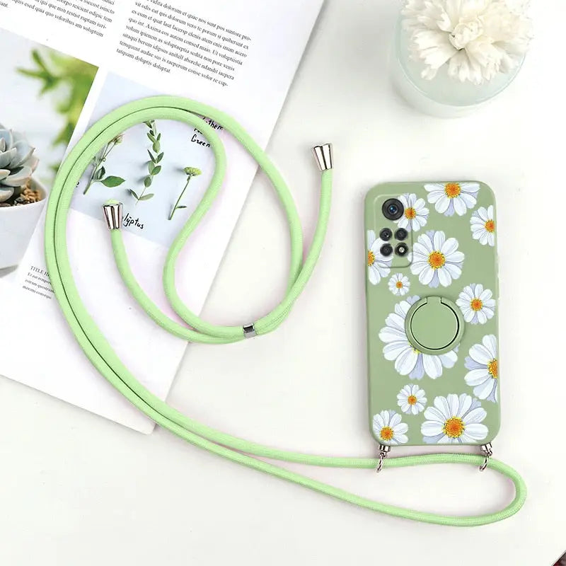 a green phone case with a flower pattern