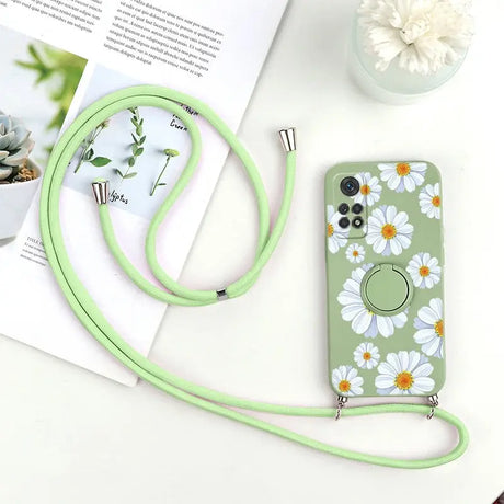 a green phone case with a flower pattern