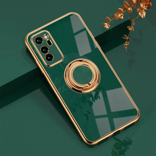 a green phone case with a gold ring