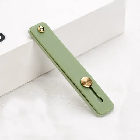 A green phone case with a gold ring