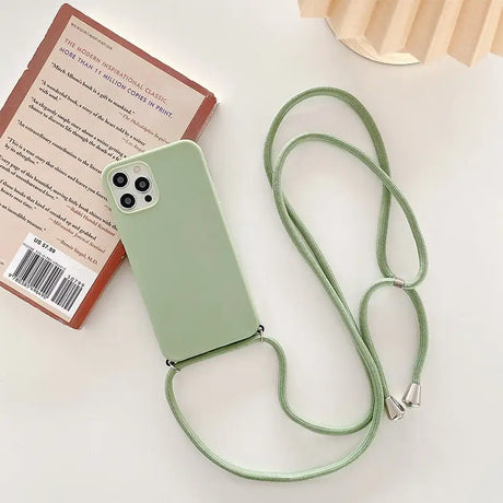 there is a green phone case with a lanyard attached to it