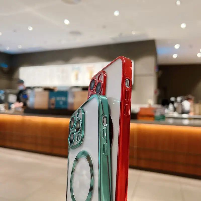 a red and green phone sitting on top of a table