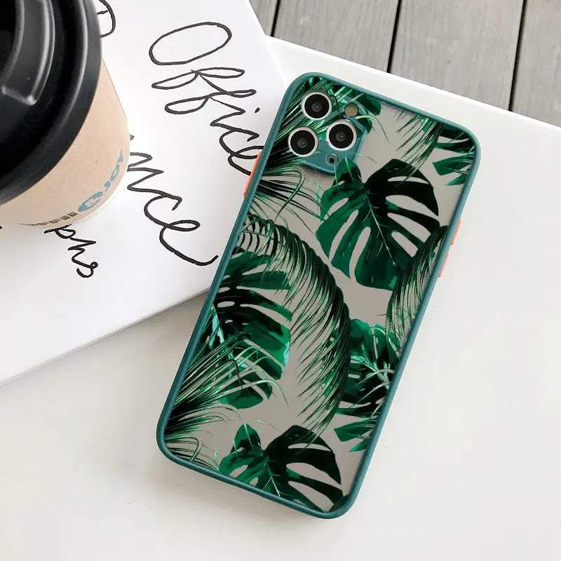 a green phone case with a tropical print