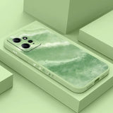 a green phone case with a watercolor painting on it