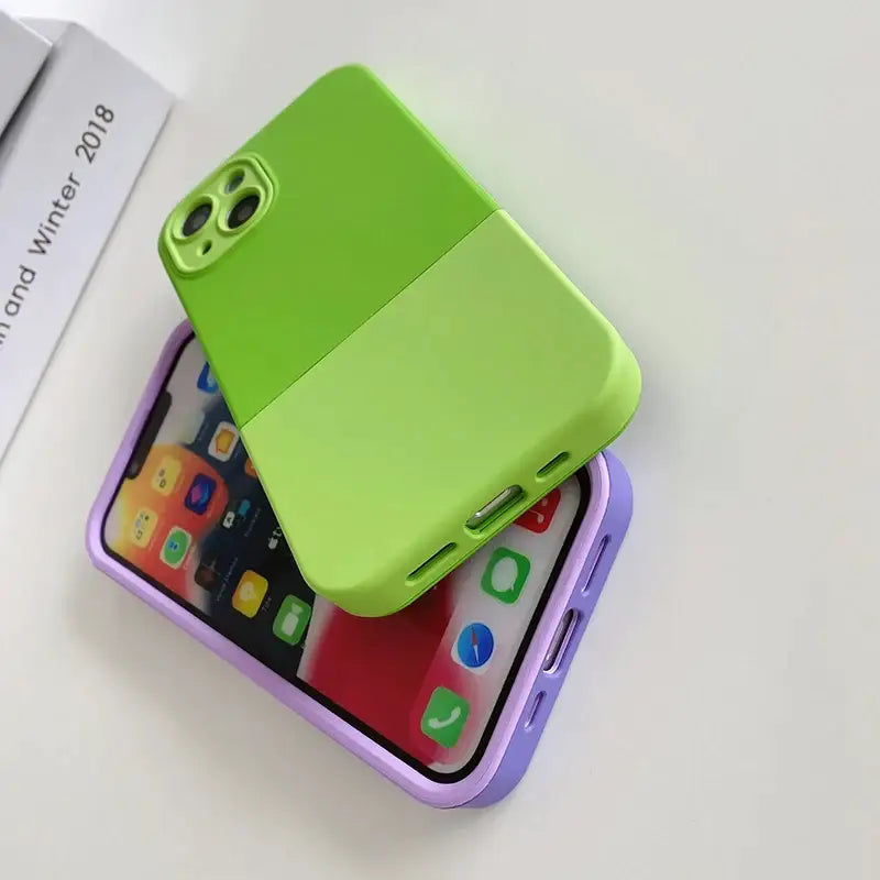 a green phone case sitting on top of a white table