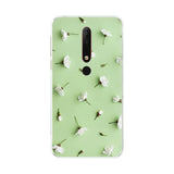a green phone case with white flowers on it