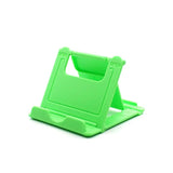 a green plastic phone stand