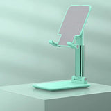 a green phone stand on a white surface