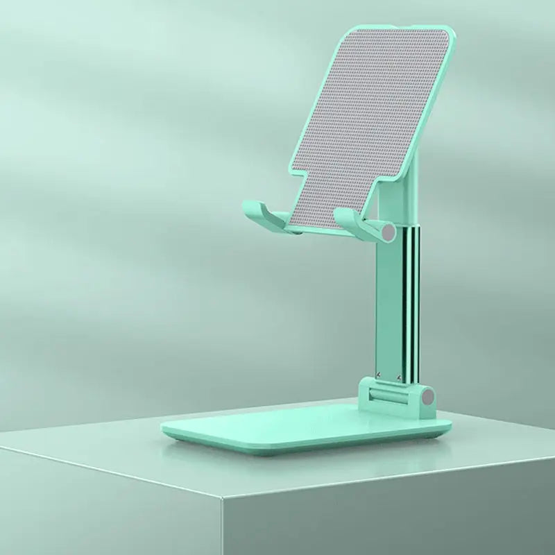 a green phone stand on a white surface