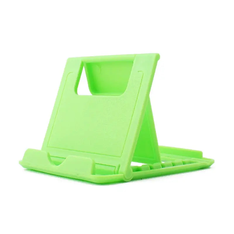 a green plastic phone stand