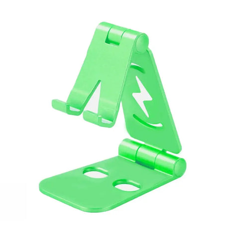 a green plastic phone stand with a white background