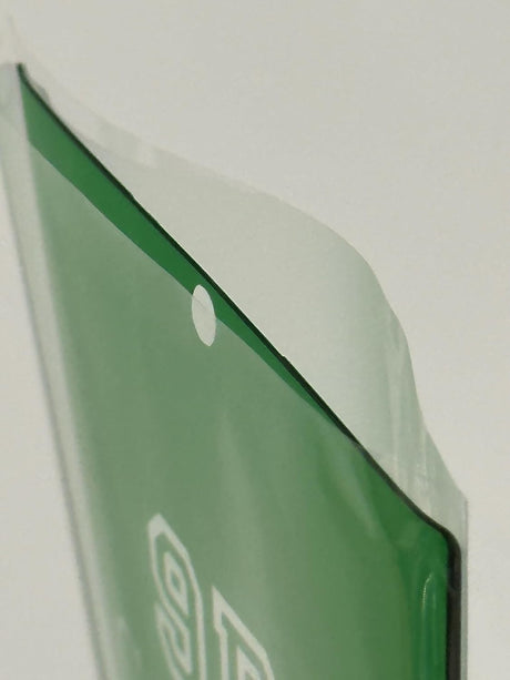 Green plastic bag with a hole.
