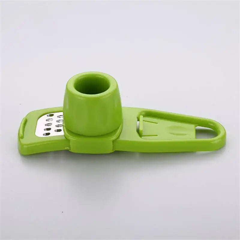 a green plastic bottle opener with a metal handle