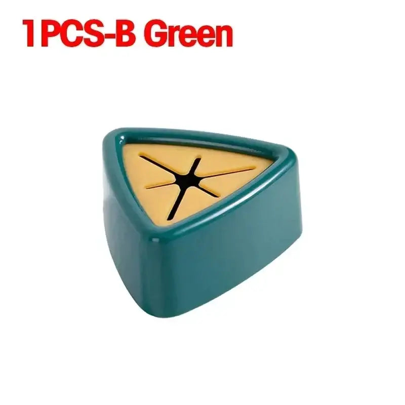a green plastic triangle shaped object with a black arrow