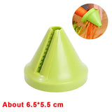 a green plastic vegetable cutter with a hand holding it