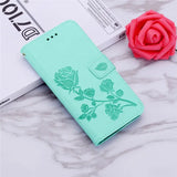 a green phone case with a rose design