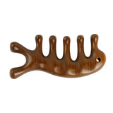 a wooden hair clip with a long, wavy hair