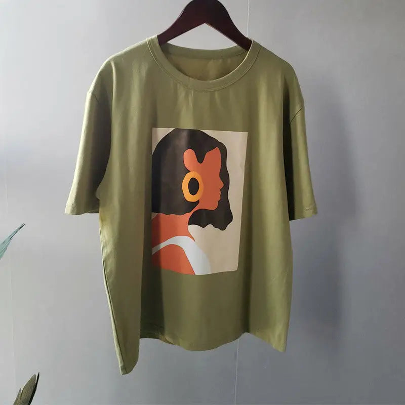 a green t - shirt with a picture of a woman’s face