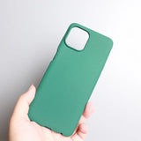 Green smartphone case held in a hand.